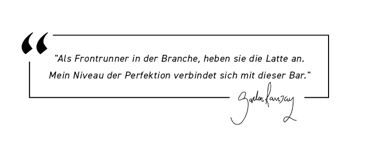 German quote with signature inside a speech bubble graphic.
